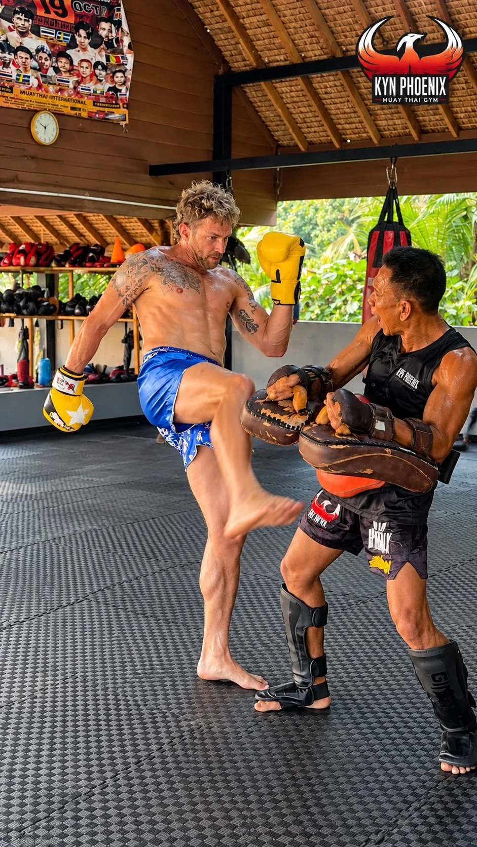 Knee strikes on the pads with a KYN Phoenix trainer